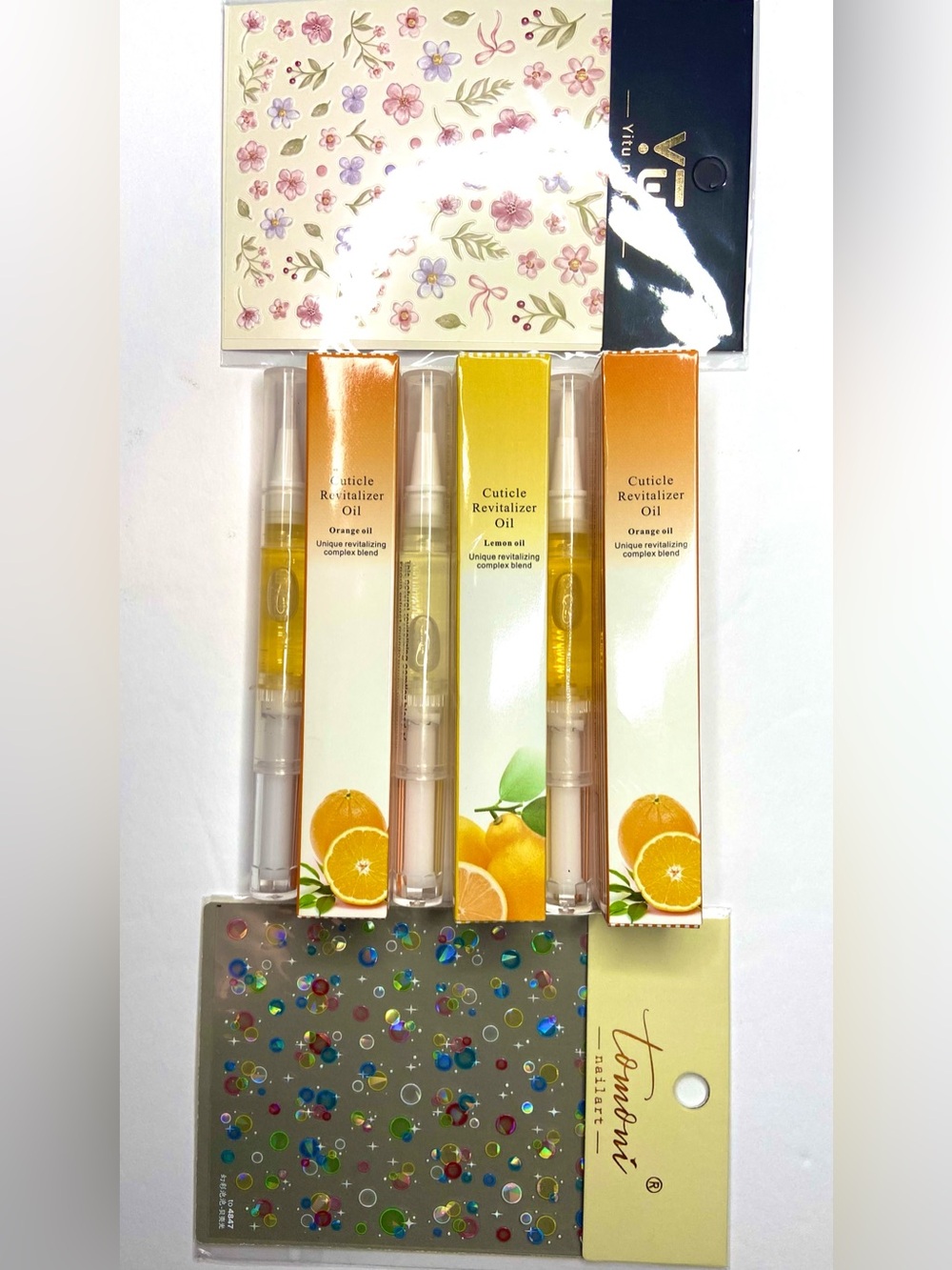 Three cuticle oil and two nail stickers